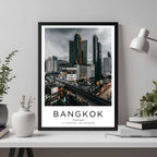 A framed Bangkok travel poster displayed in an office, adding a sophisticated and professional touch to the workspace.