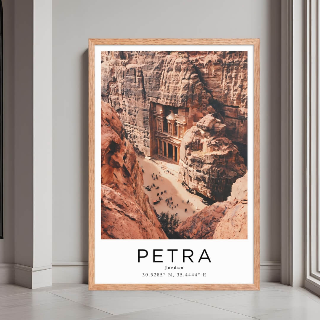 A framed poster of The Treasury in Petra, Jordan, with a red oak wood frame, styled in a luxurious modern interior.