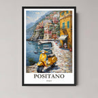 A framed, vibrant illustration of Positano, Italy, featuring cliffside houses, the Mediterranean Sea, and a bright yellow Vespa, displayed in a black frame.