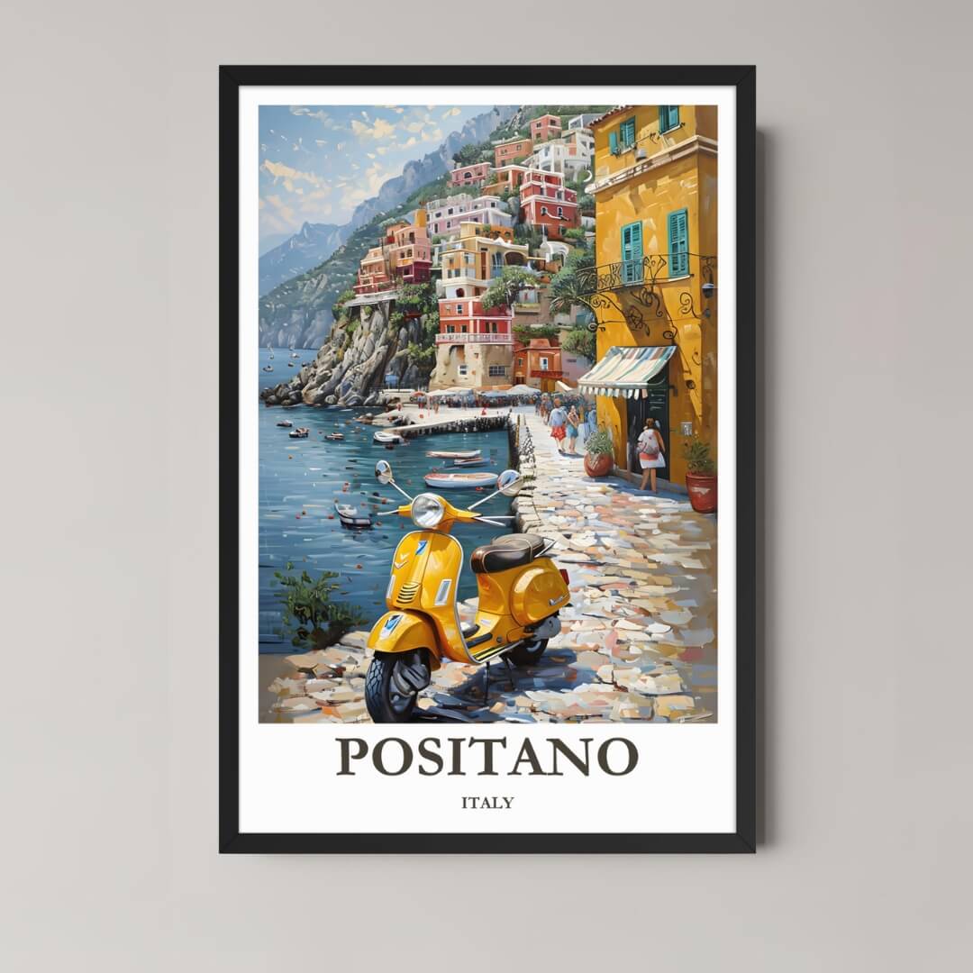 A framed, vibrant illustration of Positano, Italy, featuring cliffside houses, the Mediterranean Sea, and a bright yellow Vespa, displayed in a black frame.