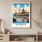 A framed art print depicting a vibrant Budapest cityscape reflected on the river, styled to complement a light and elegant interior.