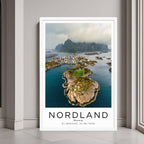 A framed wall art print of a Norwegian village and its unique landscape with a minimalist white frame.