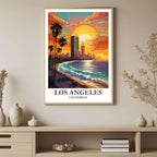 A framed art print depicting the vibrant Los Angeles sunset and coastal scene, styled to complement a light and airy interior.