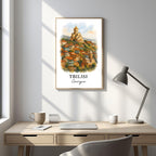 Framed Tbilisi cityscape art displayed in an office or study. Adds a sophisticated, cultural, and inspiring atmosphere.