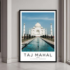A framed poster of the Taj Mahal in Agra, India, with a classic black frame, styled in a luxurious modern interior.