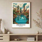 A framed art print depicting a vibrant Brisbane cityscape surrounded by tropical greenery, styled to complement a light and airy interior.
