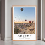A framed print of Göreme, Turkey, with a rustic red oak wood frame, highlighting the unique rock formations and scenery.