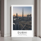 A framed wall art print of the Dubai skyline, featuring the Burj Khalifa and highways, with a minimalist white frame.